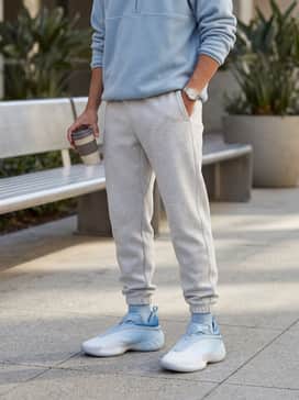 Heather grey tech-fleece joggers with a matching light blue quarter-zip pullover to create a cohesive and comfortable athletic look.