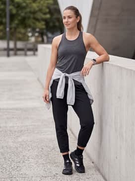 Combine with tapered tech joggers, a moisture-wicking racerback tank, and a lightweight windbreaker for outdoor drills or warm-ups.