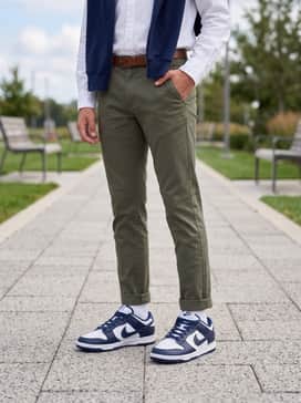 Pair with slim-cut olive green chinos and a tucked-in white oxford shirt, adding a navy crewneck sweater draped over the shoulders for a refined, preppy aesthetic.