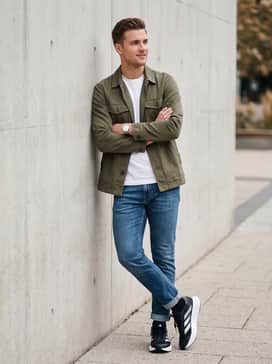 Duramo Sl 2 Wide Running Shoes – Slim-fit athletic jeans in a medium wash worn with a basic white t-shirt and an unbuttoned olive green utility jacket for a rugged casual vibe.