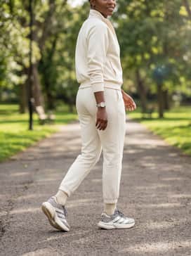 A monochromatic cream or off-white tracksuit to lean into the neutral tones of the shoe's midsole while letting the animal print serve as a statement piece.