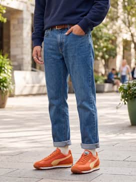 Navy blue joggers with a grey heathered hoodie and a baseball cap for a comfortable, athletic weekend outfit.