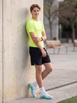 F50 Messi Club Firm Ground  Multi Ground Football Boots – A high-intensity drill outfit with a neon lime compression shirt, black lightweight athletic shorts, and low-cut white performance socks for a sleek, speed-focused aesthetic.