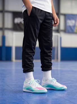 Comfortable black tapered joggers paired with a grey performance hoodie for a functional pre-game warm-up outfit.