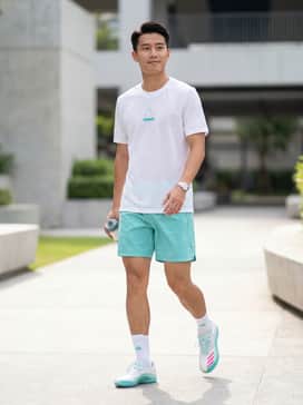 F50 Messi Club Turf Football Shoes – A professional white athletic jersey with teal accents and matching lightweight performance shorts for a high-intensity match.