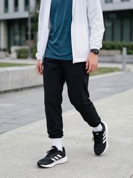 Falcon 3 Sport Lace Shoes – A high-performance athletic look featuring black moisture-wicking leggings, a teal breathable mesh tank top, and a lightweight white windbreaker for morning track practice.