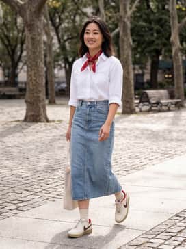 Field General Se Lny – A pair of high-waisted straight-leg denim jeans in a light wash, paired with a crisp white oversized button-up shirt tucked in, and a red bandana tied around the neck to pull out the shoe's lining.