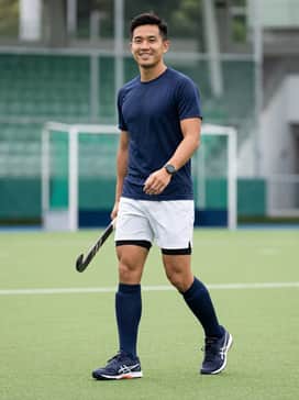 A navy blue moisture-wicking team jersey paired with breathable white athletic shorts and navy knee-high performance socks.