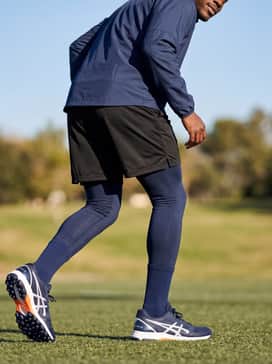 Field Ultimate Ff 2 – Navy blue compression leggings under black mesh shorts with a lightweight windbreaker for early morning field drills.