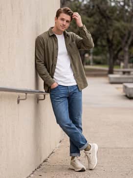 Flare Pro Trail Puretrex – A rugged casual ensemble consisting of straight-leg raw denim jeans with a rolled cuff, a heavyweight white tee, and an unbuttoned olive flannel shirt.