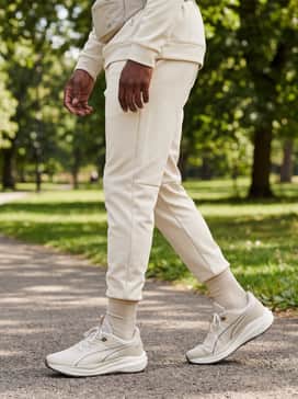 Flare Pro Trail Puretrex – An elevated tonal athleisure set with cream-colored tapered sweatpants and a matching beige quarter-zip performance pullover.