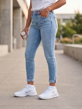 Cuffed light-wash skinny jeans worn with a simple tucked-in white graphic tee and minimalist silver jewelry to complement the shoe's metallic accents.