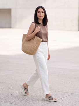 Pair with high-waisted white linen trousers, a tucked-in sleeveless mocha silk blouse, and an oversized straw tote for an elegant seaside lunch.