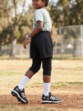 Forum Tpu Kids Baseball Cleats – A coordinated practice set consisting of a graphic sports tee, sliding shorts for protection, and white crew-length athletic socks.