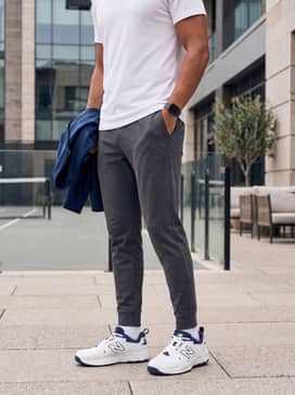 Fresh Foam X 1007 – Slim-fit charcoal grey joggers and a crisp white heavyweight cotton t-shirt for a clean, modern streetwear look.