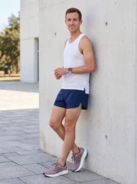 Combine with navy blue split running shorts and a white mesh tank top for a breathable warm-weather training outfit.