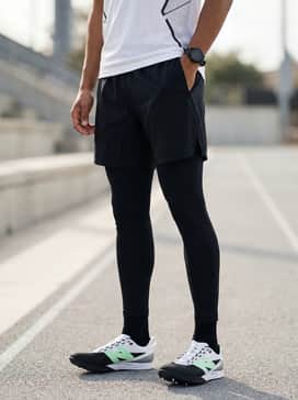Fuelcell Flited – A professional race-day look with a white and black geometric print singlet paired with aerodynamic split running shorts.