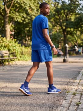 Breathable athletic mesh shorts in royal blue combined with a moisture-wicking technical tee for a court-ready ensemble.