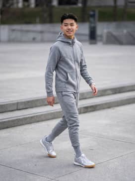A monochromatic look featuring a heather grey tech-fleece tracksuit to allow the metallic silver finish of the shoes to stand out as a statement piece.
