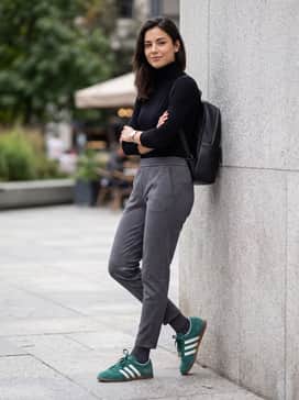 Gazelle Lo Pro Shoes – Tailored charcoal joggers, a black fitted turtleneck, and a sleek leather backpack to create a sharp, modern streetwear aesthetic.