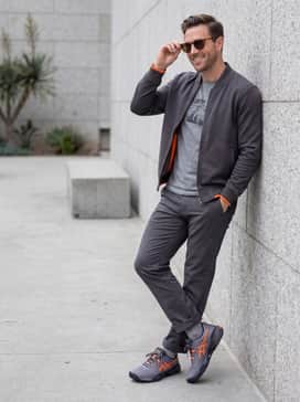 Gelresolution X – A casual weekend ensemble consisting of slim-fit black jeans, a heather grey graphic tee, and a lightweight orange-lined bomber jacket to echo the shoe's accents.