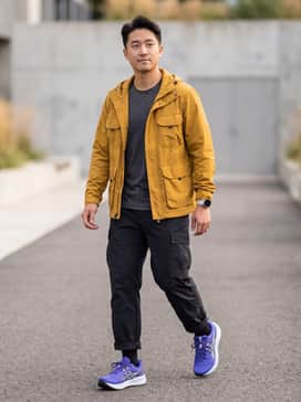 Gelsonoma 8 – A technical 'Gorpcore' ensemble featuring black ripstop cargo pants, a charcoal grey moisture-wicking base layer, and a mustard yellow weather-resistant windbreaker to play off the bold purple hue.