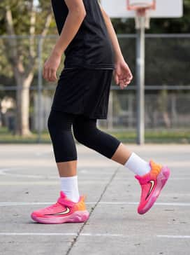 Giannis Immortality 4 – A black basketball uniform with high-top white socks for a professional court-ready appearance.