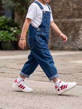 Denim dungarees over a crisp white t-shirt, letting the ladybug design be the focal point of the outfit.