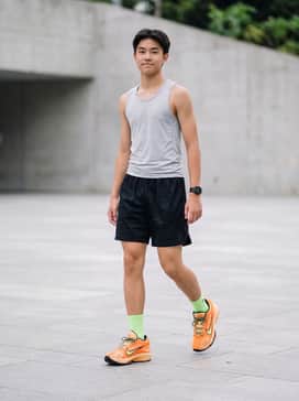 Gt Hustle 3 Haunted Heights – A performance-ready look featuring black mesh basketball shorts, a light grey moisture-wicking tank top, and neon green crew socks to match the shoe's lime-colored swoosh.