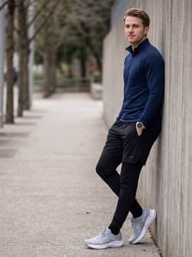Gt2000 14 Atc – Black tapered technical joggers and a slim-fit navy blue quarter-zip pullover for a clean, athletic look that transitions from the track to the gym.