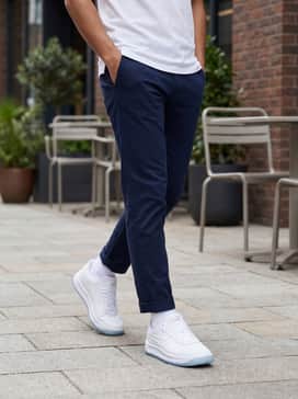 Gv Special Boss – Style with navy slim-fit chinos and a tucked-in white polo shirt to embrace a clean, tennis-inspired preppy aesthetic perfect for casual social gatherings.