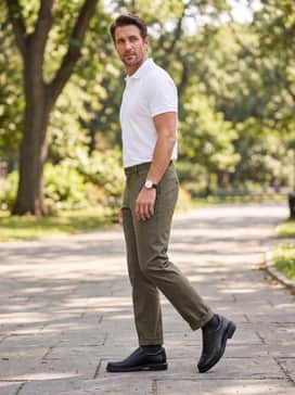 Olive green or forest green trousers paired with a high-quality white pima cotton polo shirt for a refined yet relaxed office environment.