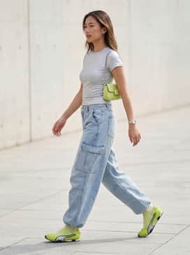 Hstreet Ballet Womens Sneakers – A pair of light-wash baggy cargo pants paired with a silver baby tee and a lime green mini bag for a cohesive Y2K-inspired streetwear look.