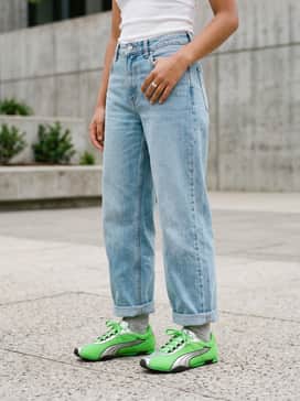 Hstreet Og – Style with light-wash wide-leg denim, a white ribbed tank top, and neon green accessories like a beanie or socks for a coordinated pop.