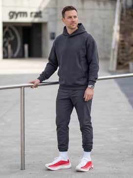 Hyperboost Edge Running Shoes – Tapered charcoal grey tech joggers with a crisp white oversized hoodie for a modern streetwear-meets-function vibe.