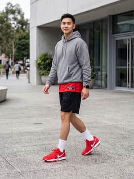 Ja 2 – A professional on-court look featuring black mesh basketball shorts, a matching red moisture-wicking jersey, and white crew-length athletic socks to accentuate the shoe's profile.