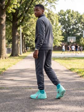 Ja 3 12 Time – A full charcoal grey tracksuit with subtle teal piping to allow the bright sneakers to serve as the primary focal point.