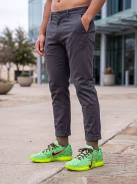 Ja 3 Spooky Season – An edgy streetwear ensemble consisting of charcoal grey slim-fit jeans, a vintage-wash oversized black graphic tee, and a chocolate brown chore coat to complement the laces.