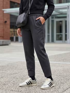 Combine the shoes with charcoal tailored joggers, a black cropped zip-up hoodie, and a sleek leather crossbody bag to achieve a sophisticated streetwear aesthetic.