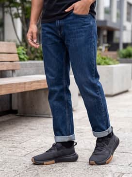 Kaptir 40 Wide Shoes – Slim-fit dark indigo jeans with a cuffed hem to show off the gum sole, styled with a crisp white t-shirt and an unbuttoned olive flannel shirt.