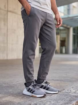 Match the shoes with black tapered joggers, a charcoal oversized hoodie, and a minimalist black baseball cap for a modern, monochromatic street aesthetic.