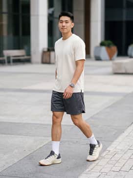 Kd18 Beyond The Game – A professional on-court look featuring charcoal performance mesh shorts, a cream moisture-wicking jersey, and white crew-length athletic socks to highlight the gum sole.