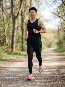 Pair with black moisture-wicking compression leggings and a neon orange racerback tank to highlight the midsole's vibrant gradient for a high-visibility trail look.