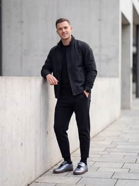 Style with black tech-fleece joggers and a matching matte technical windbreaker to lean into the sporty, futuristic vibe of the shoe.