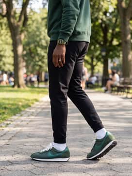 Ld1000 Sp – Style with tapered black joggers and a matching forest green hoodie to lean into a coordinated and modern athleisure aesthetic.