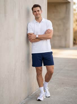Combine with tailored navy blue athletic shorts and a crisp white polo for a clean, sporty summer ensemble perfect for casual outings.