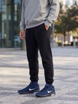 Lebron Witness 9 – Black tapered joggers paired with a grey oversized hoodie for a relaxed, post-game streetwear aesthetic.