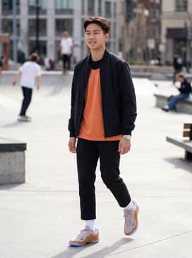 A full basketball kit featuring a sunset-orange mesh jersey and black performance shorts to mirror the sneaker's vibrant overlays.