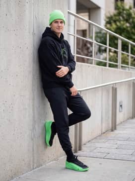 Luka 5 Venom – A streetwear-forward outfit with oversized black joggers, a heavy-weight black graphic hoodie featuring neon accents, and a matching neon green beanie to balance the colors.