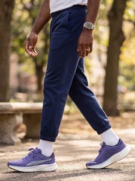 Magnify Nitro 2 – A modern lounge aesthetic consisting of navy blue fleece sweatpants, a matching quarter-zip sweatshirt, and a sleek silver-toned sports watch to complement the metallic branding.